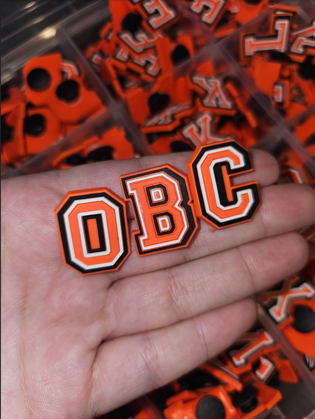 Orange letter shoe charms