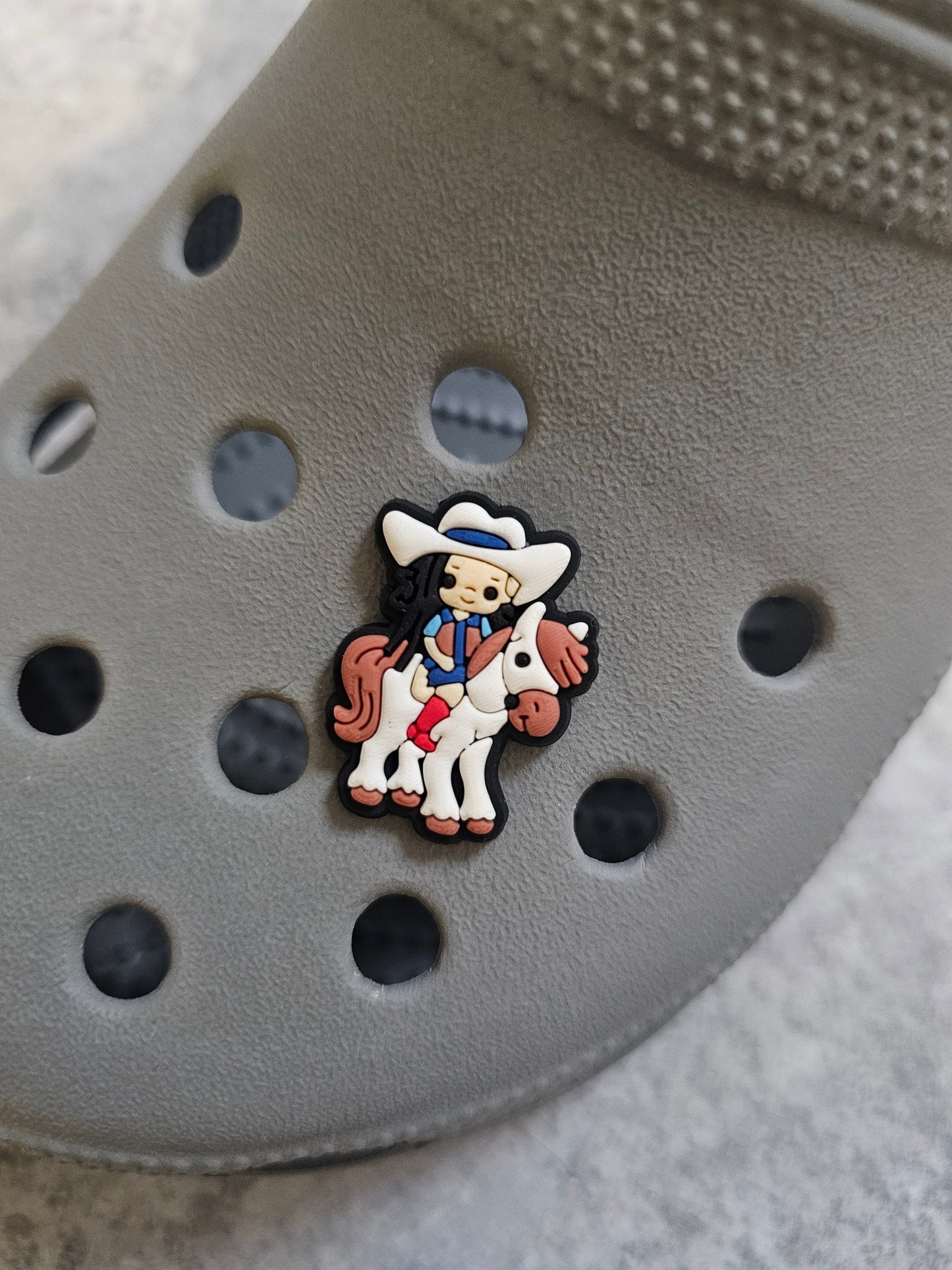 Horse rider, girl black hair riding a horse shoe charm