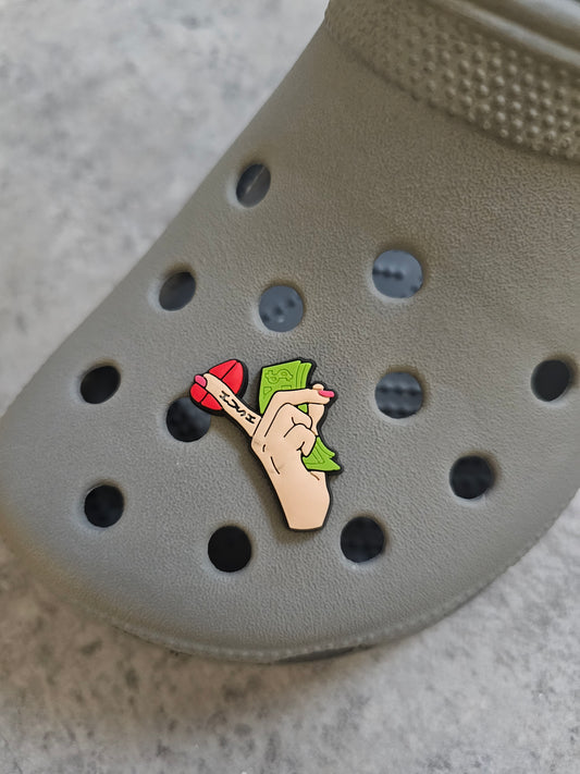 Money, finger on lips holding notes shoe charm